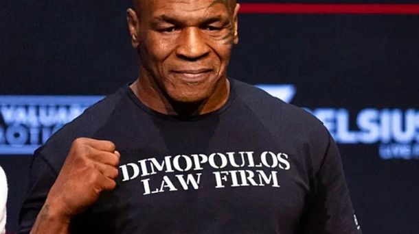 Myke Tyson wearing Dimopoulos Law t-shirt during New York Press Conferece for the upcoming fight against Jake Paul